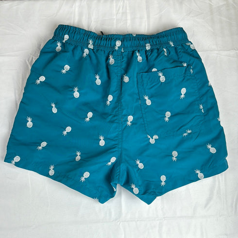Peacock green pineapple swim shorts